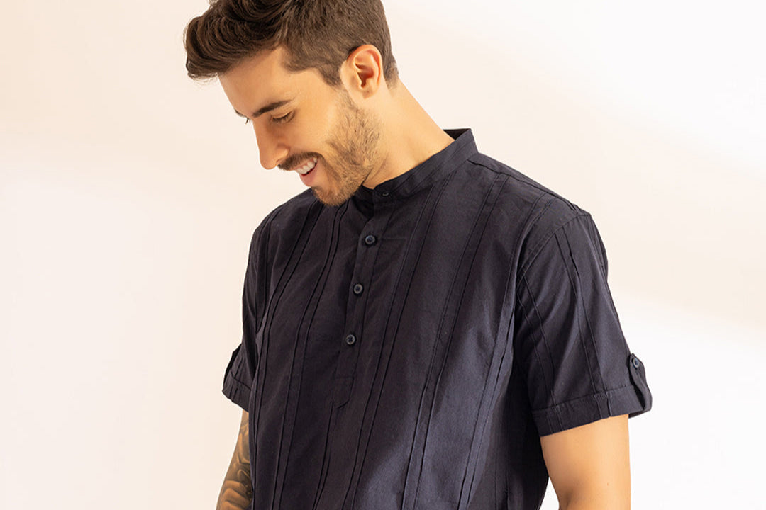 Indian man wearing a linen pintucked kurta suitable for festive season and holidays like diwali, rakhi, navratri etc